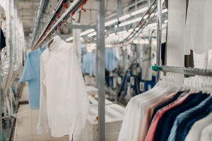 Dry Cleaning Clothes. Clean Cloth Chemical Process. Laundry Industrial Dry cleaning